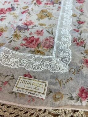 Nina Ricci handkerchief featuring a floral print, butterfly and lace detailing